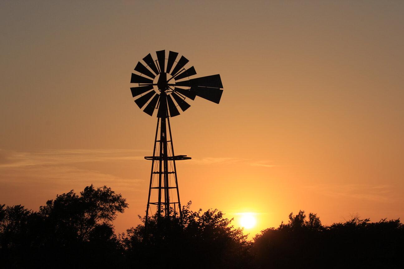 Outdoor sunset image of windmill