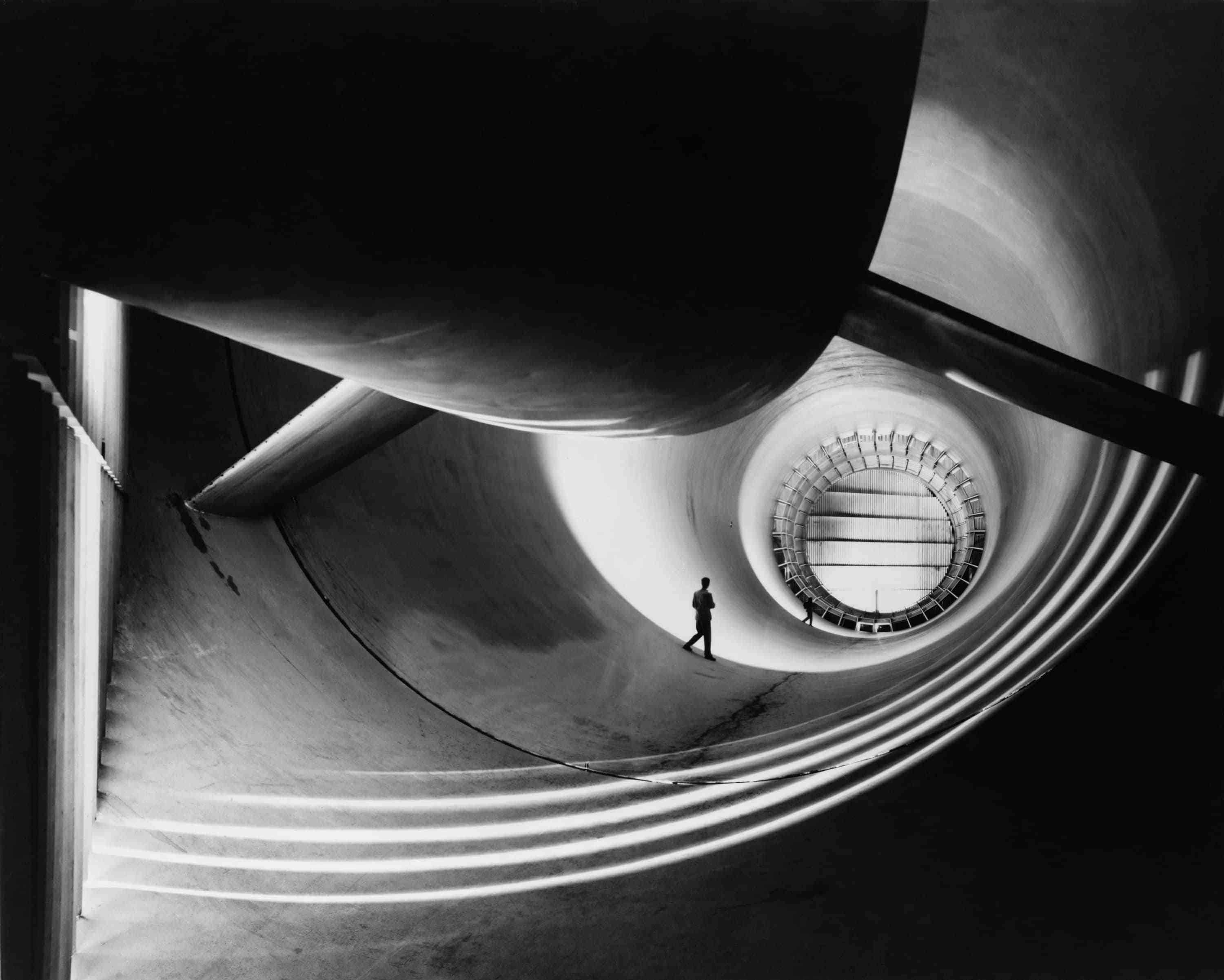 Man in a giant turbine tunnel