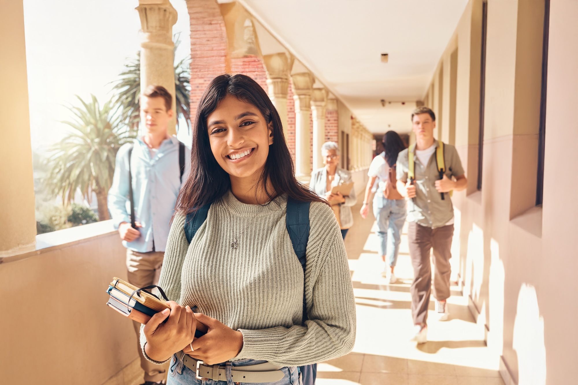 Motivated female student on campus in the summer
