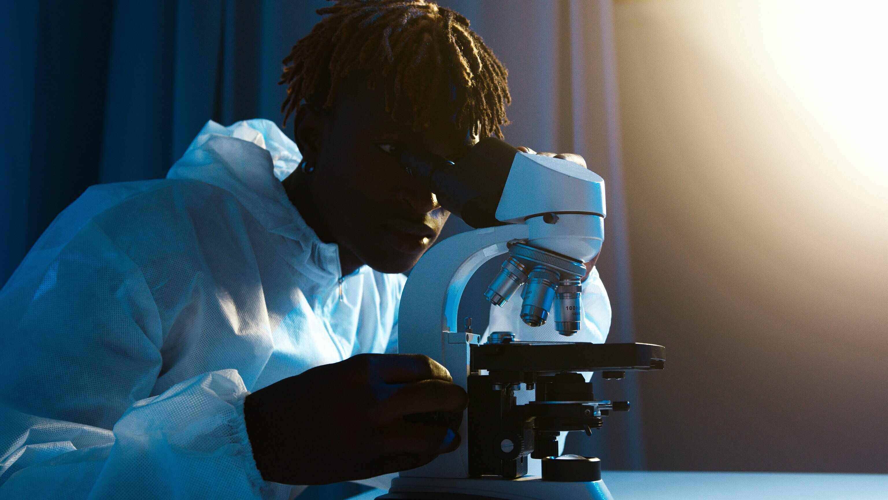 researcher with microscope