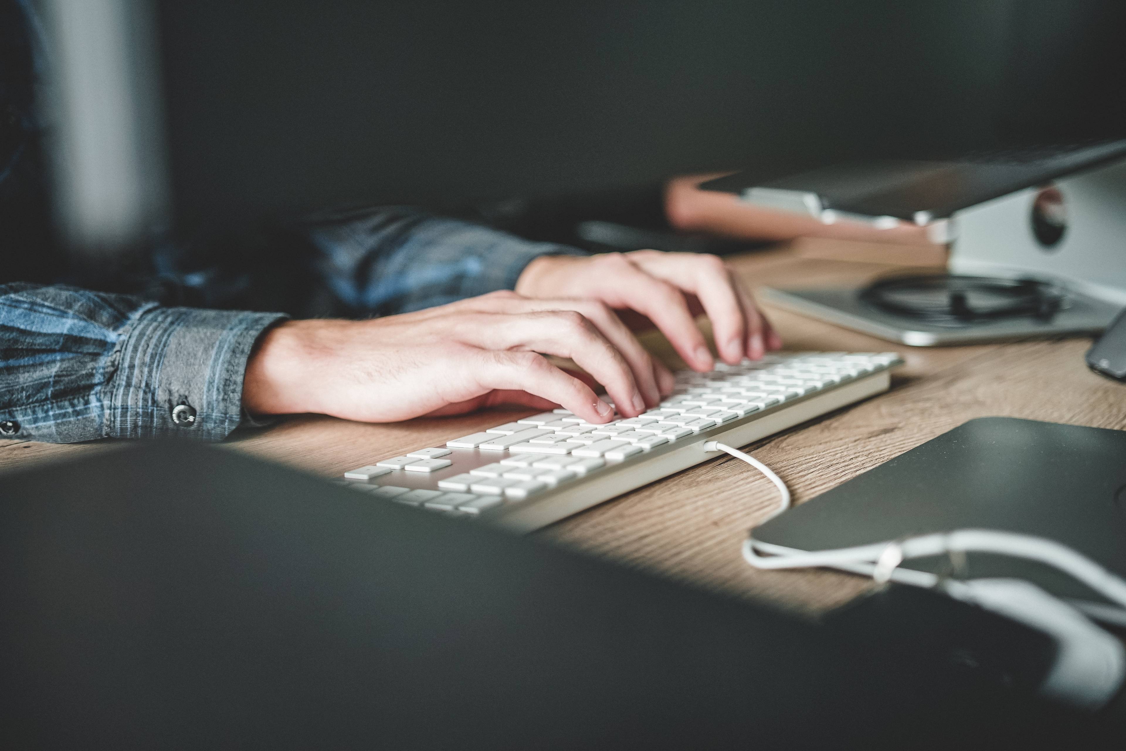 hands on a computer keyboard