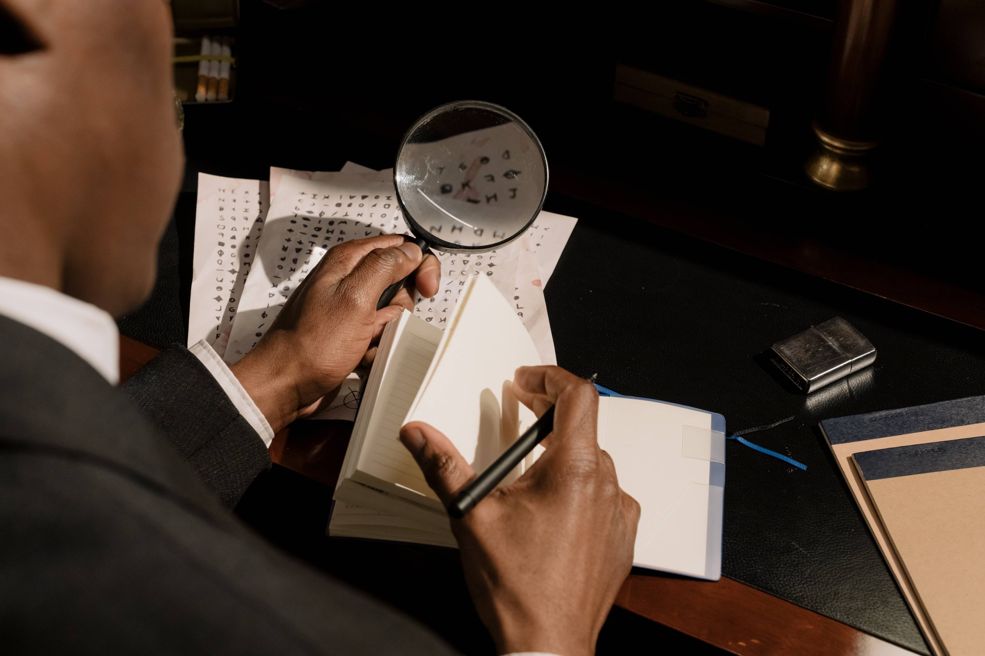 A man uses magnifier to read his notes.