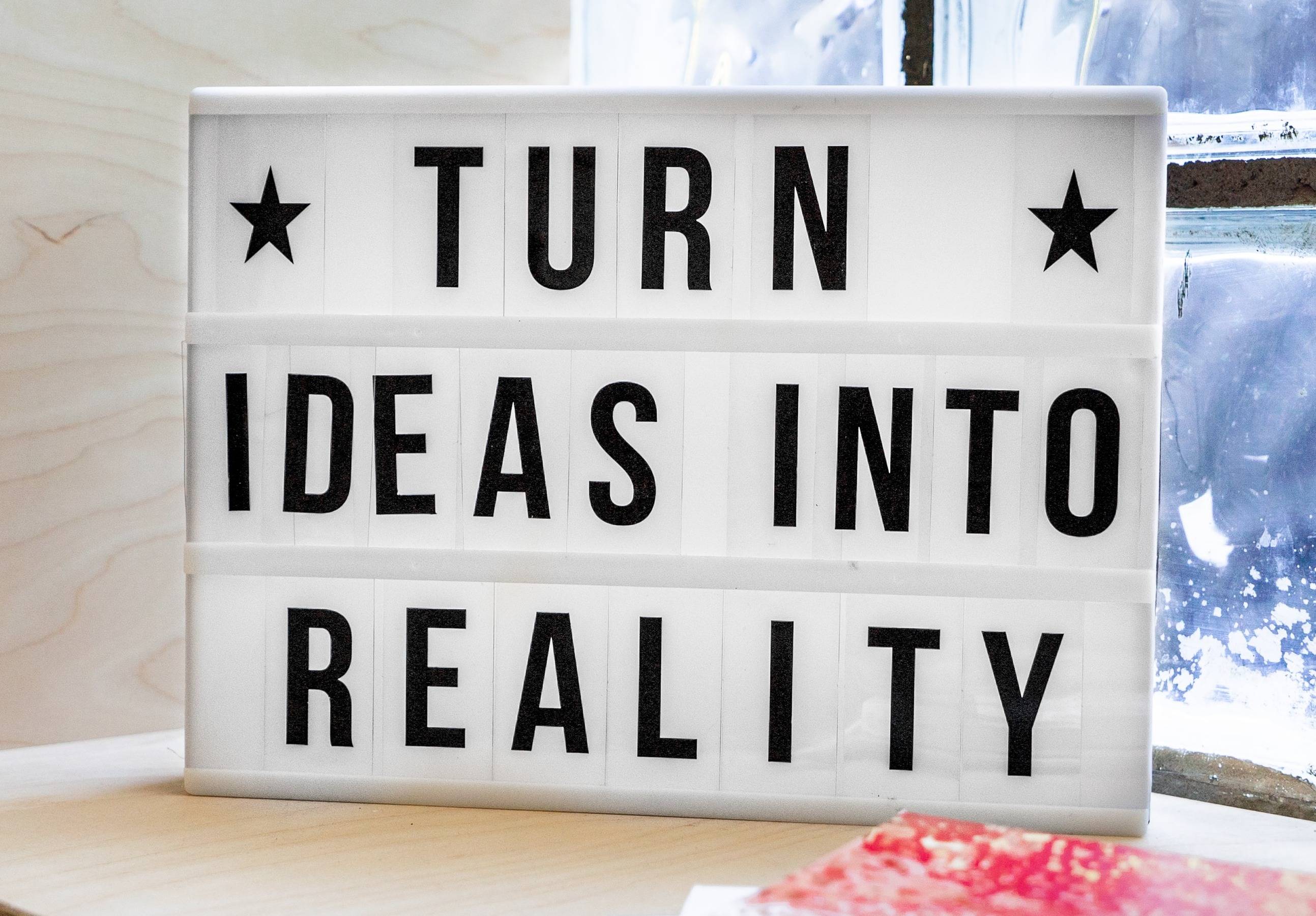sign that says "turn ideas into reality"