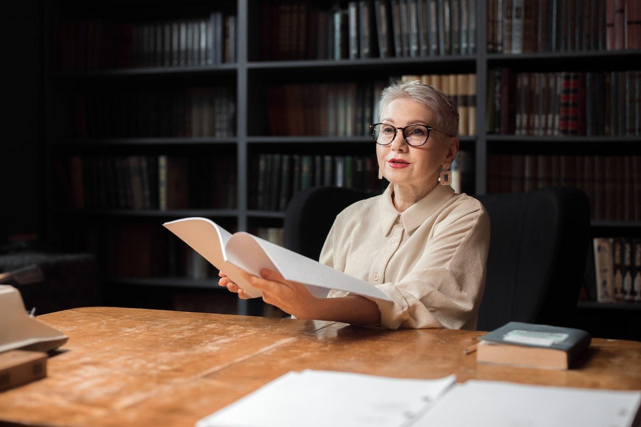 Female professor reviewing student work