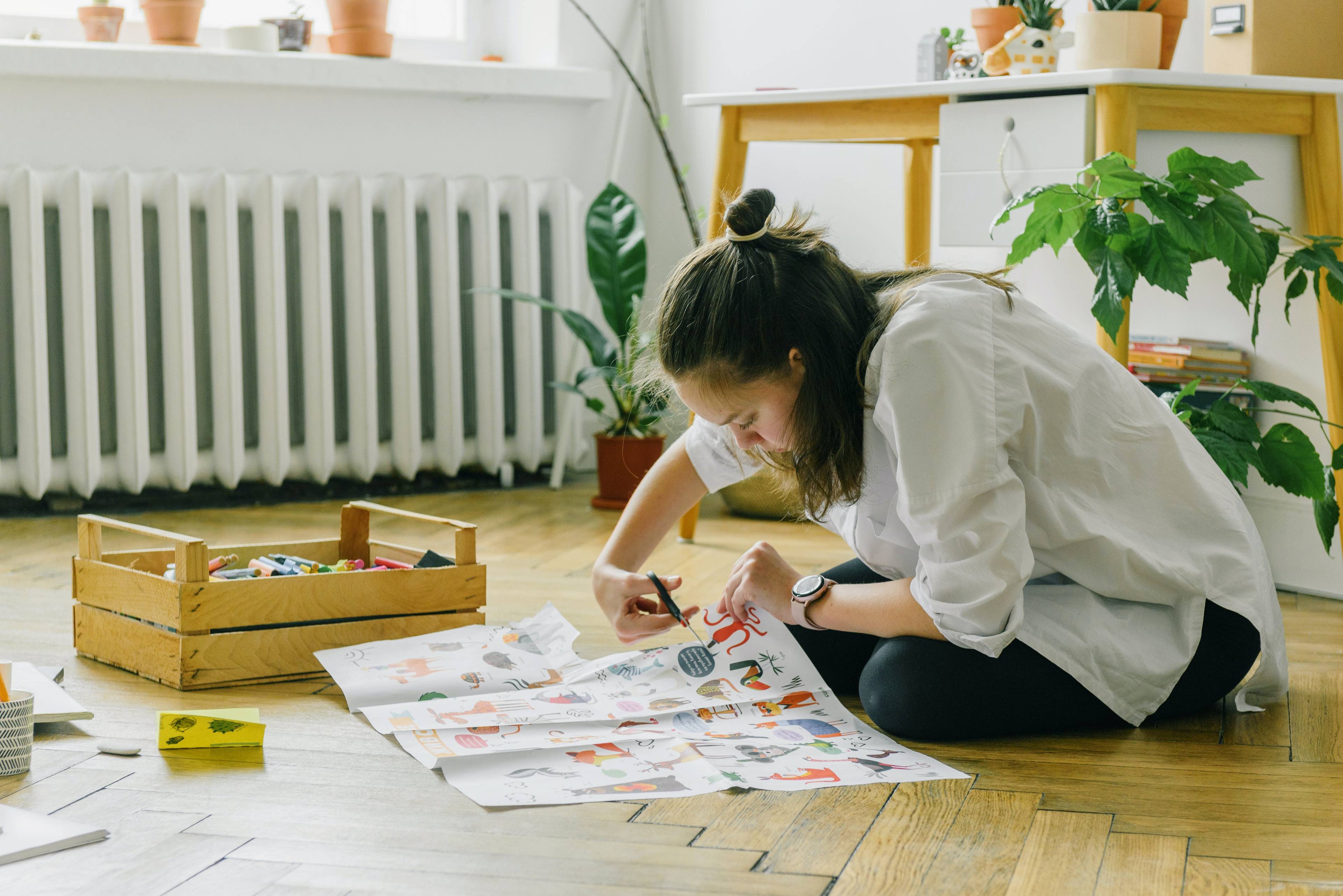 high school student working on a passion project on floor