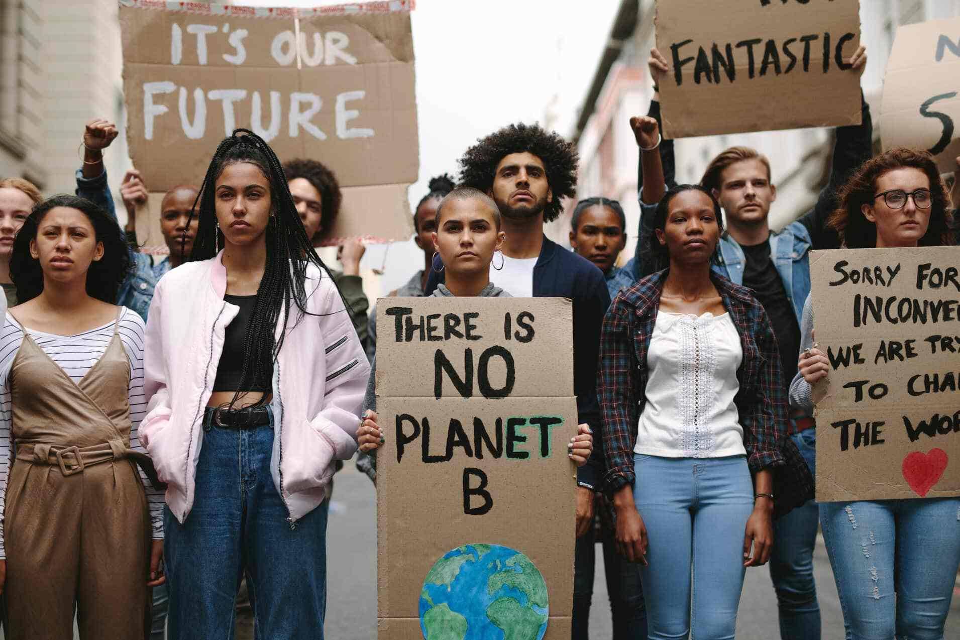 Group of young people holding signs of protest