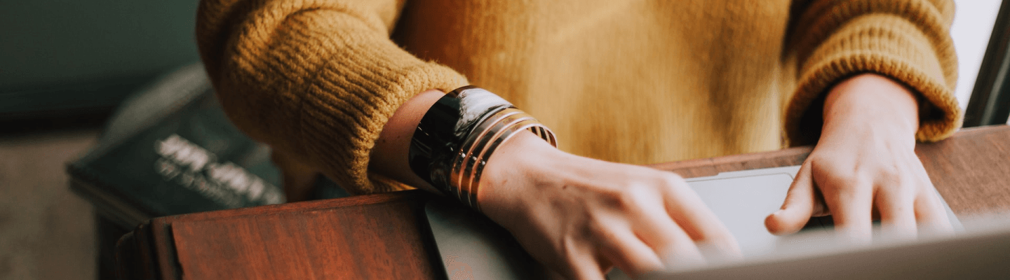 Woman writes on computer