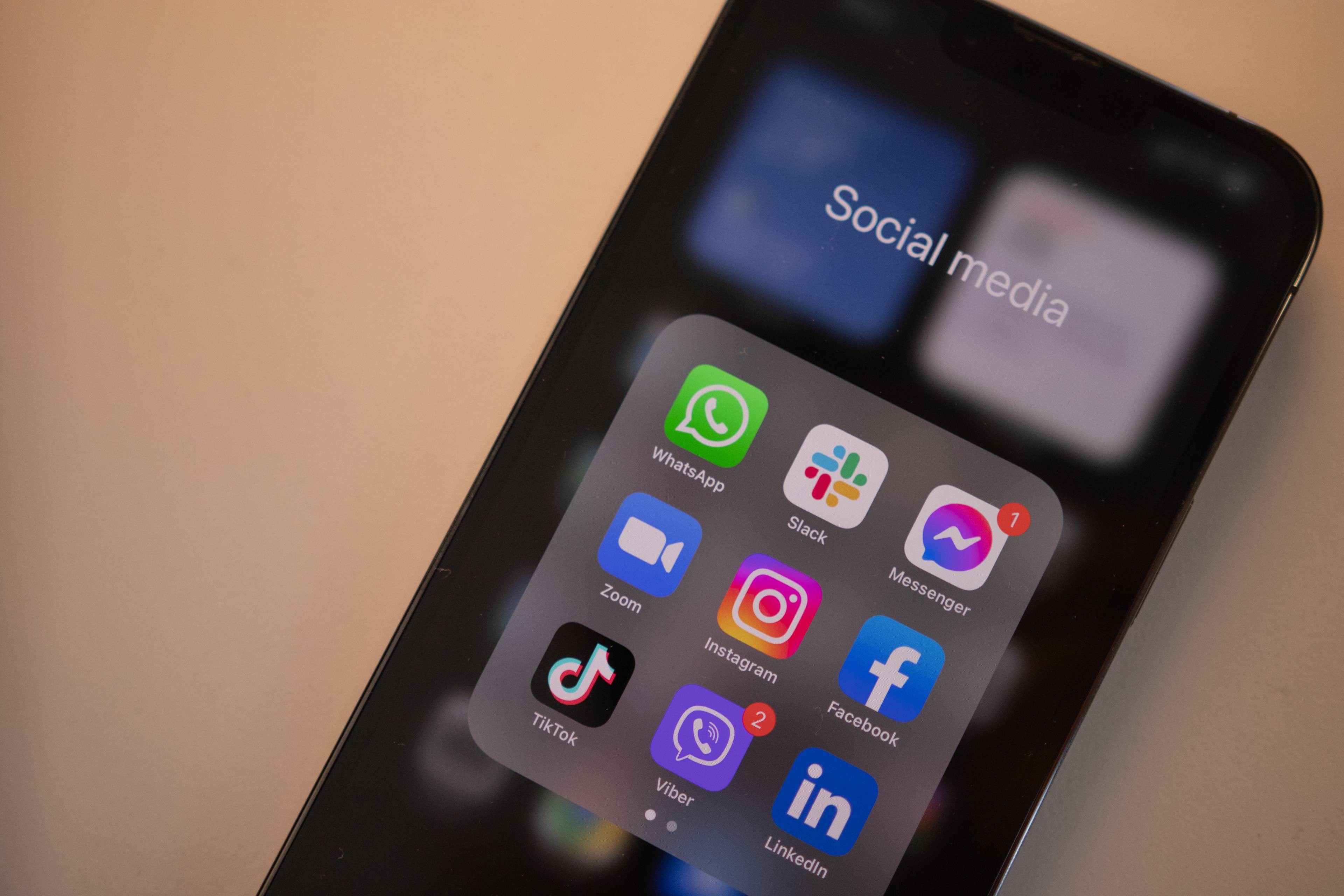 iphone with social media apps open