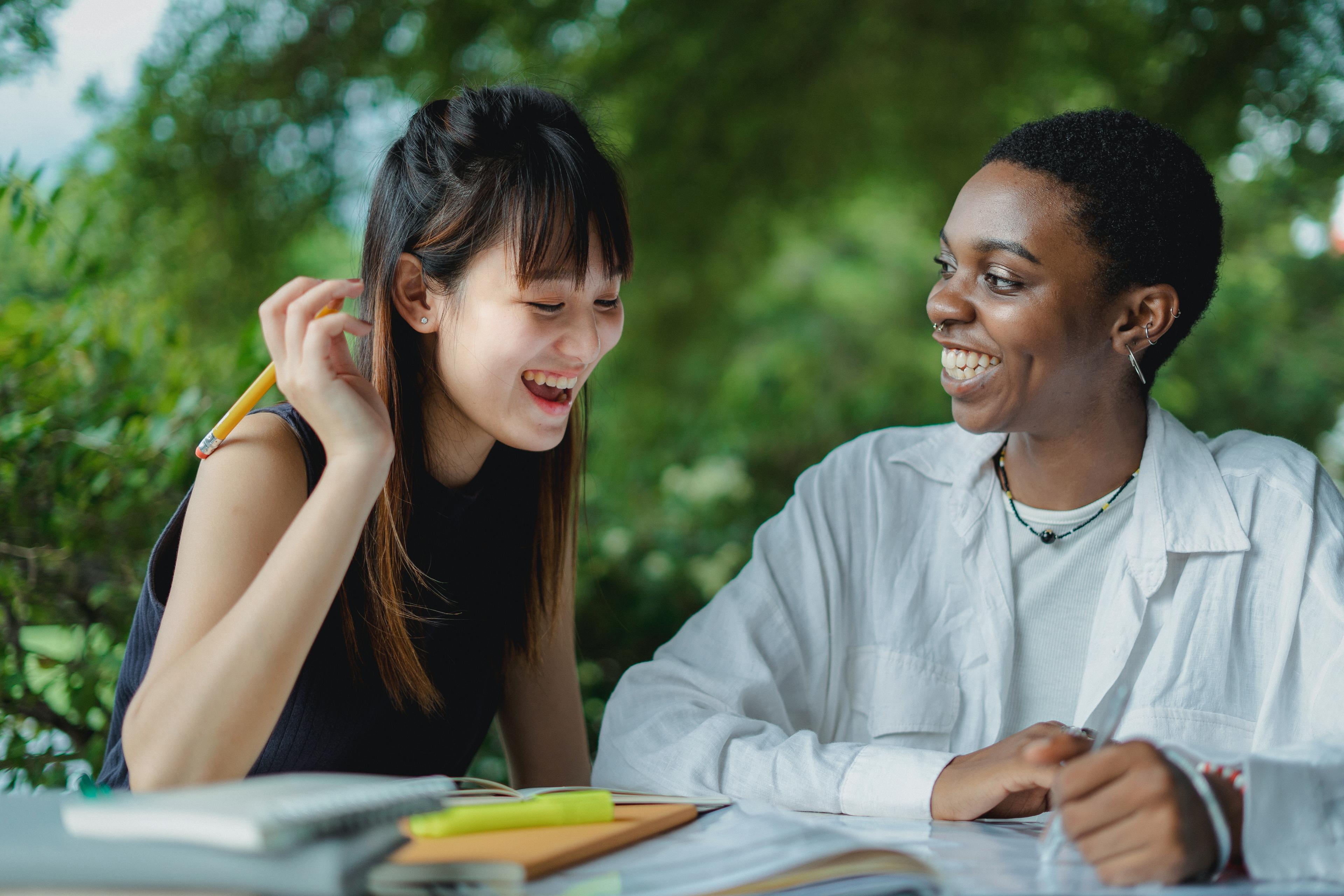 Expert mentor and student smiling