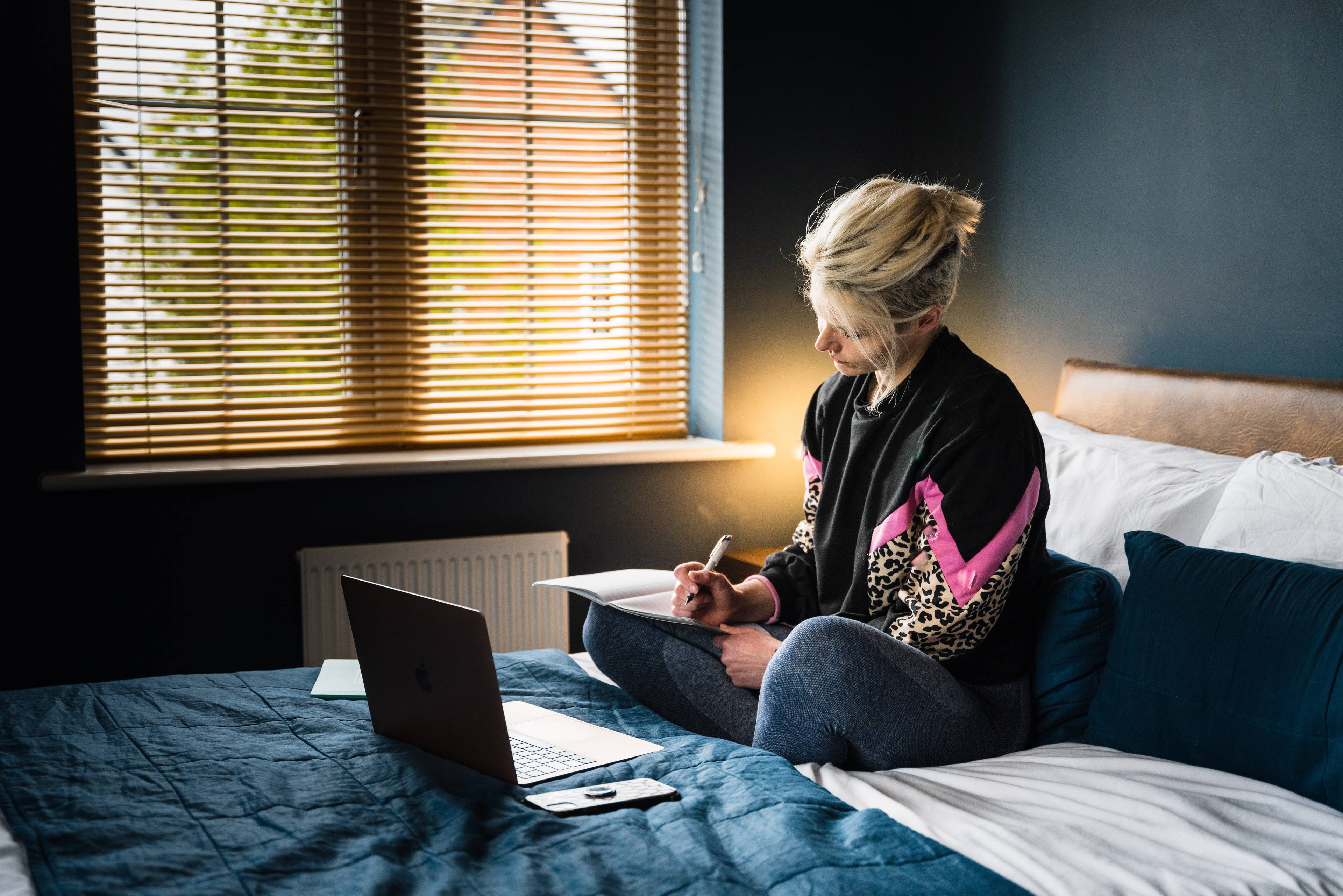 woman in black on her laptop