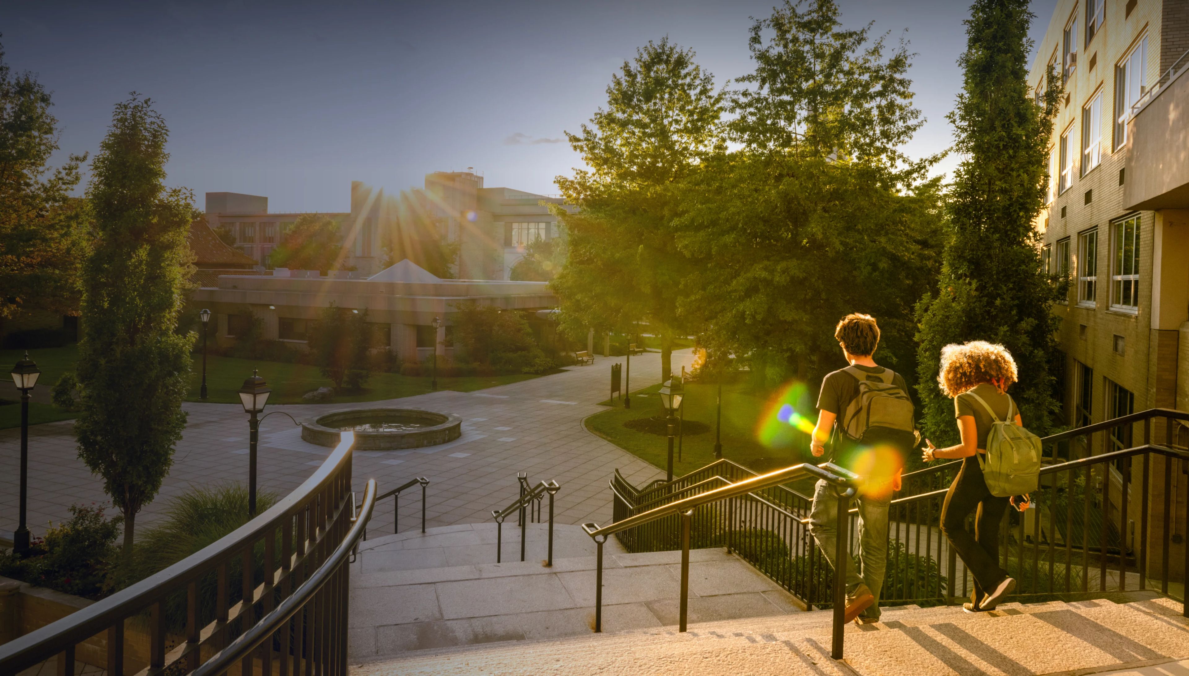 Two students walking at a university campus