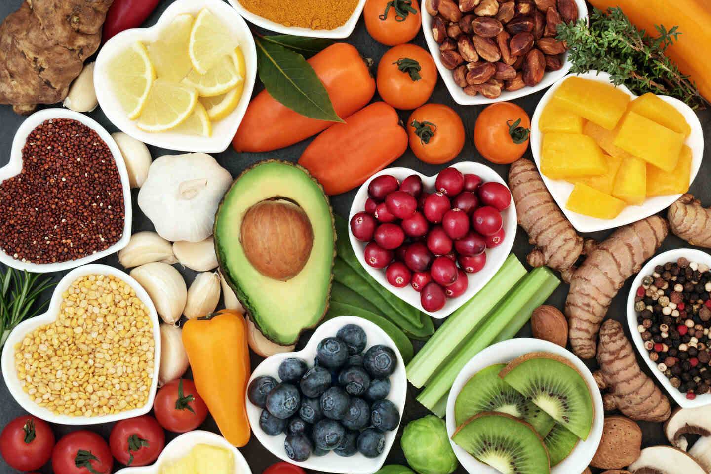 Fruit and vegetables on table and heart shaped plates